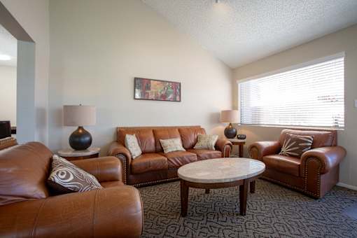 a living room with couches and a coffee table