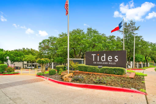 an image of the tides sign at the entrance to the city of grand prairie