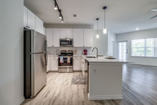 the preserve at ballantyne commons apartment kitchen with stainless steel appliances