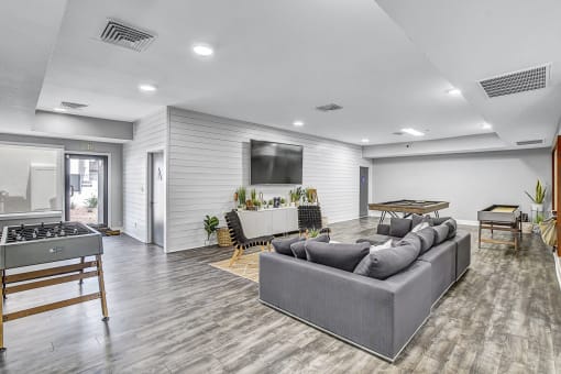 the reserve at bucklin hill clubhouse resident lounge with couches and a ping pong table