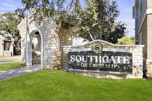 A sign that says Southgate on Emerald in front of a building.