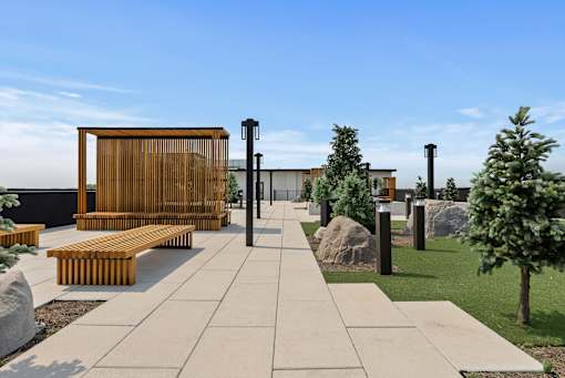 A modern outdoor seating area with benches and a wooden structure.