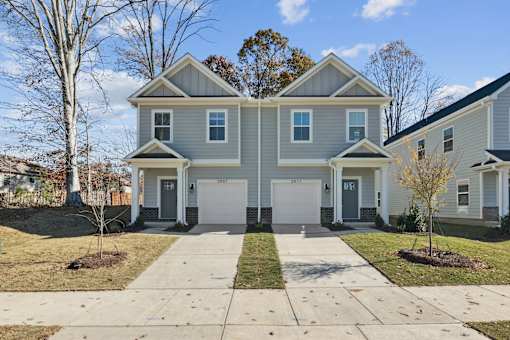 A two-story house with a grey and white exterior.