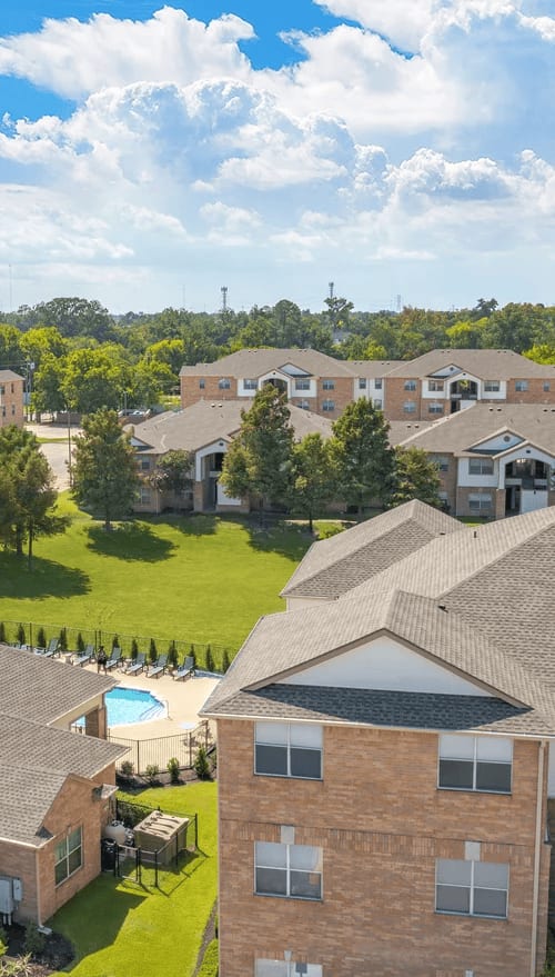 A residential area with houses and a pool.