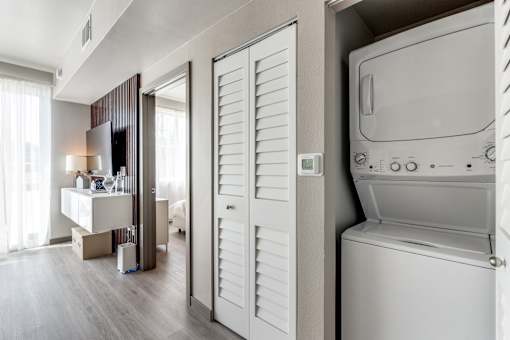 A modern laundry room with a washer and dryer.
