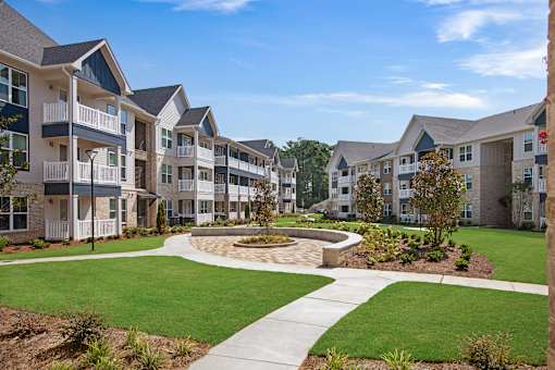 Apartment complex with a circular garden in the middle.