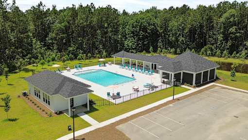 A large house with a pool in the backyard.