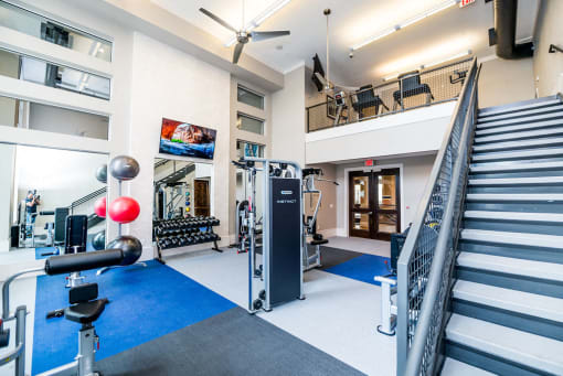 the gym at the ivy hotel is equipped with weights and cardio equipment and stairs