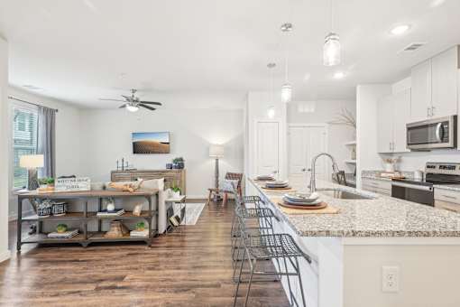 A kitchen with a counter and a sink.