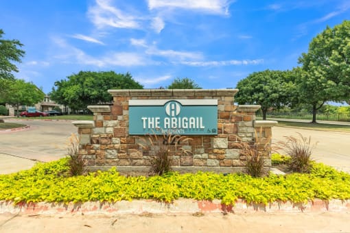 the brick sign for the regional office of the robbinsdale sign in front
