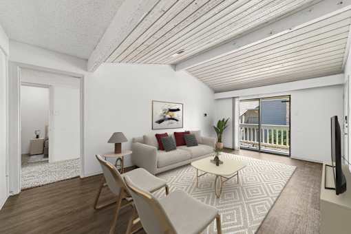 A living room with a couch, chairs, and a coffee table.