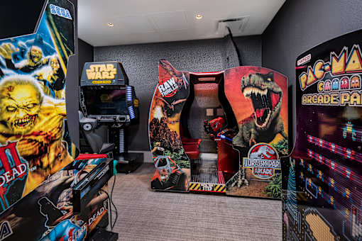 A room full of arcade games including Pac-Man.