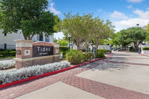 a sign that reads tides on turnpike in front of a building