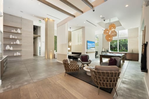 a living room with a couch and chairs and a table