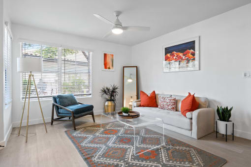 a living room with a couch and a chair