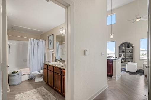 A bathroom with a toilet, sink, and shower.
