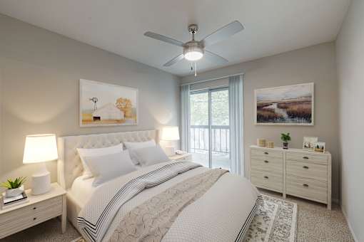 A bedroom with a large bed, a ceiling fan, and a view of the outdoors through a sliding glass door.
