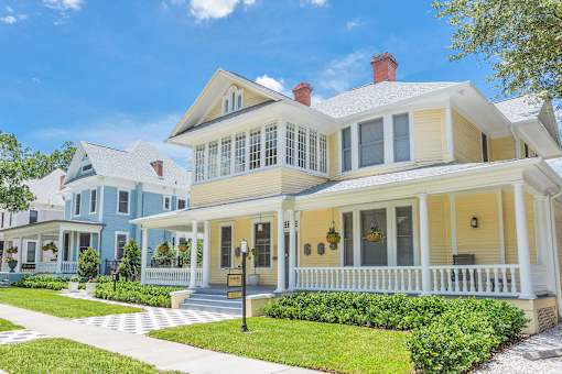 A large house with a blue and yellow exterior.