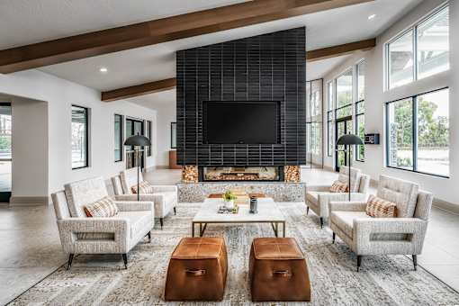 A modern living room with a fireplace and a flat screen TV.