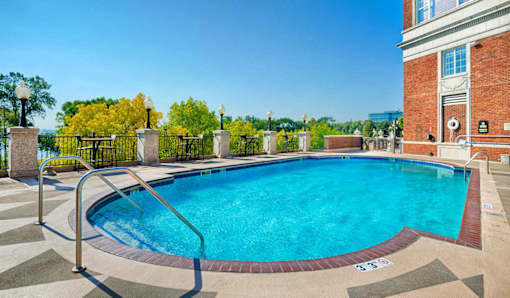 A rectangular pool with a metal railing around it.