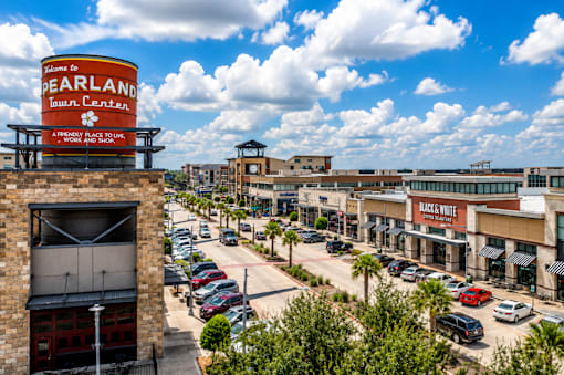 A view of a town center with a sign that reads "Pearland Town Center".