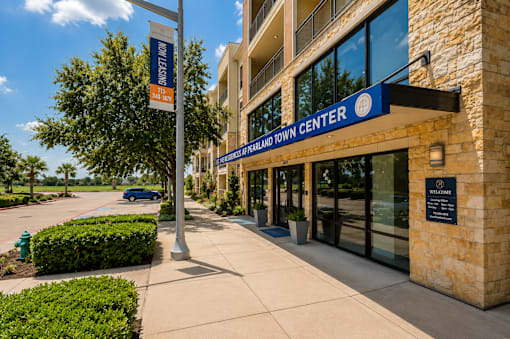 A building with a sign that says "Hilland Town Center".