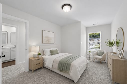 A bedroom with a bed, nightstand, and chair.
