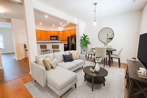 A living room with a grey couch and a coffee table.