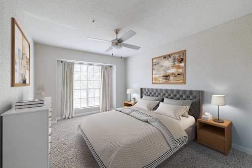 A bedroom with a large bed, a ceiling fan, and a window with curtains.