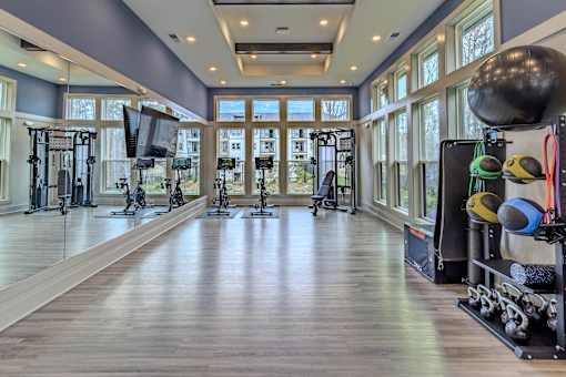 A spacious gym with a variety of exercise equipment.