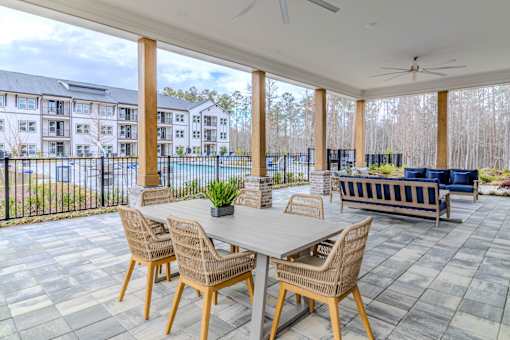 A patio with a table and chairs is shown.