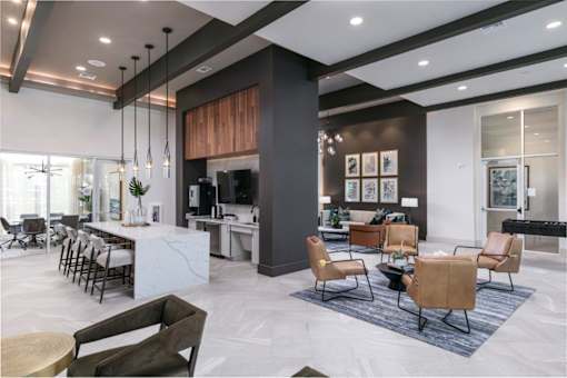 A modern living room with a white marble floor and a large sectional sofa.