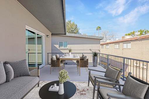 A patio with a table and chairs is shown.
