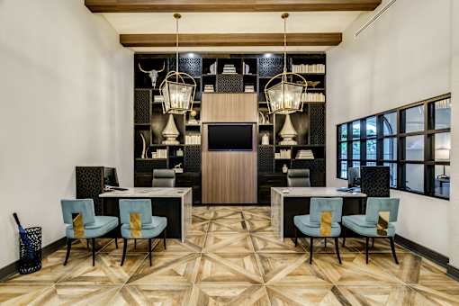 A conference room with a wooden floor and a white wall.