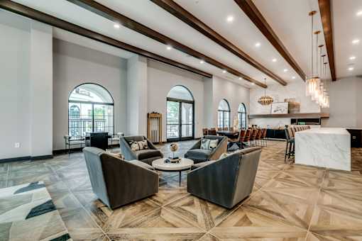 A large room with a long table and chairs.