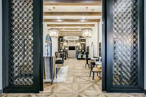 A room with a patterned floor and a patterned wall divider.