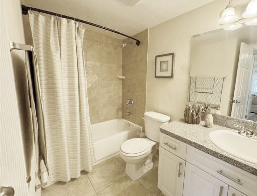 a bathroom with a sink toilet and a tub