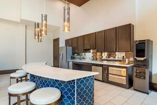 A kitchen with a blue and white counter.