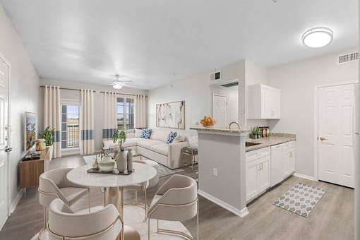 A well-lit, modern kitchen and dining area with a neutral color scheme.