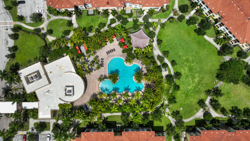 a birds eye view of the resort with a swimming pool