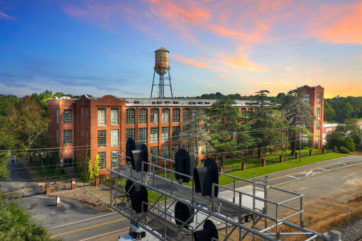 an aerial view of a building with a water tower