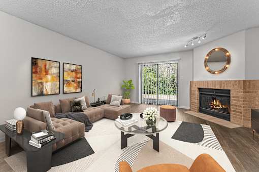 A modern living room with a fireplace and a glass coffee table.