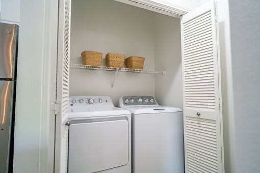 the laundry room has a washer and dryer