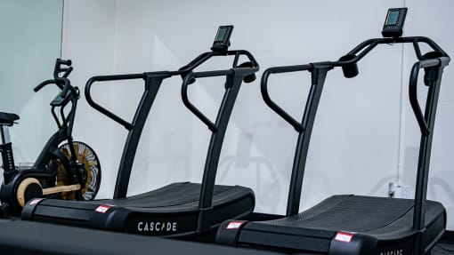 a pair of treadmills in a gym