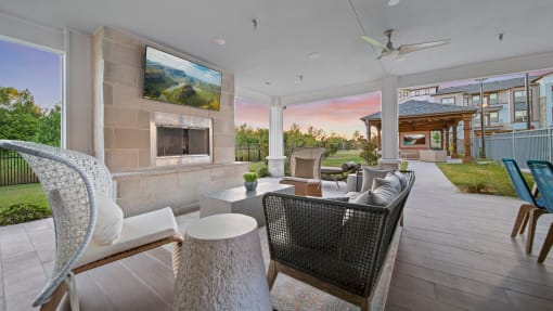 a living room with a fireplace and a tv on the wall
