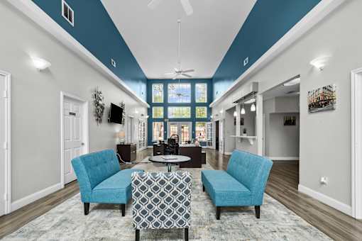 A living room with a blue and white color scheme.