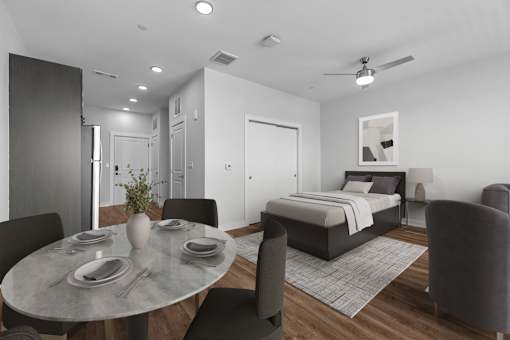 A modern bedroom with a bed, chair, and dining table.