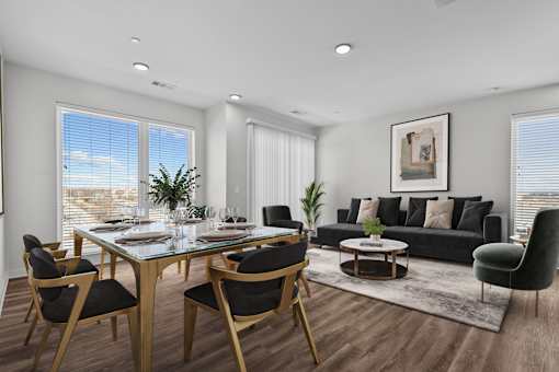 A modern dining room with a glass table and chairs.