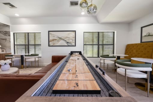 a room with a shuffleboard table in the center of it
