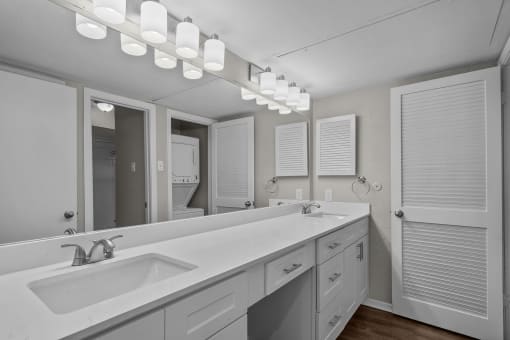 a bathroom with a large sink and a mirror